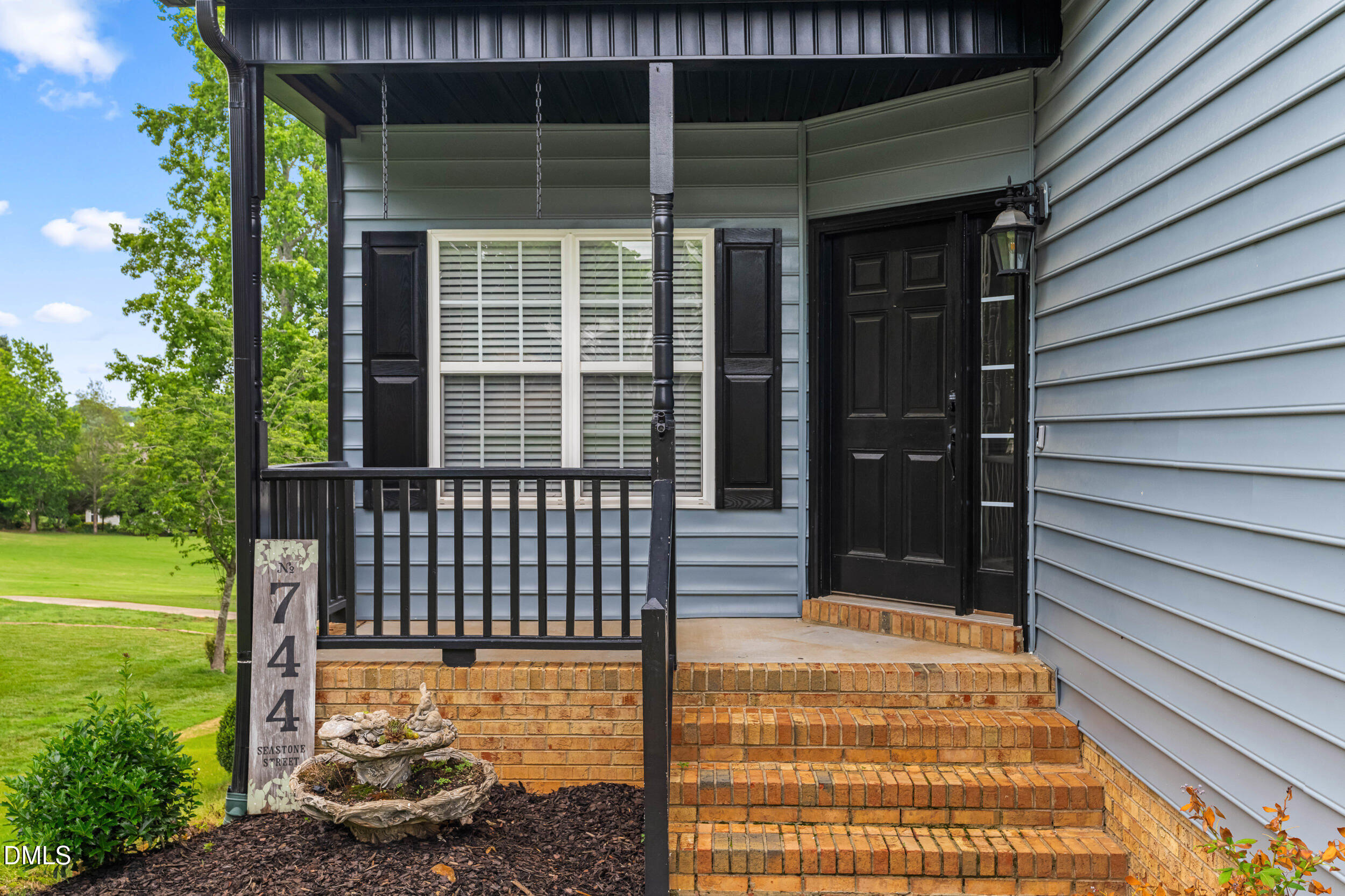 744 Seastone Street Raleigh, NC 27603 - Photo 5 of 53 a front view of a house with a garden
