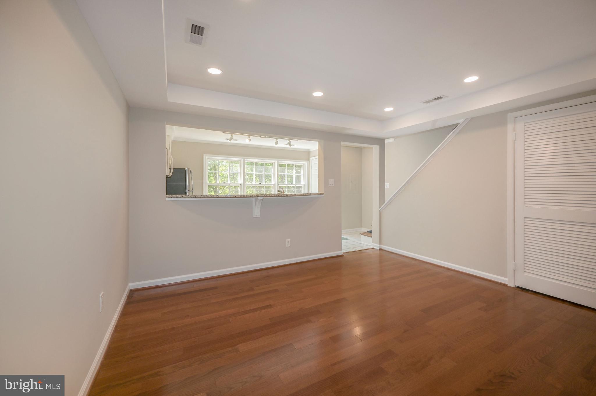 8024 Quarry Ridge Way, Unit 1B Bethesda, MD 20817 - Photo 15 of 16 Hardwood floors in family room