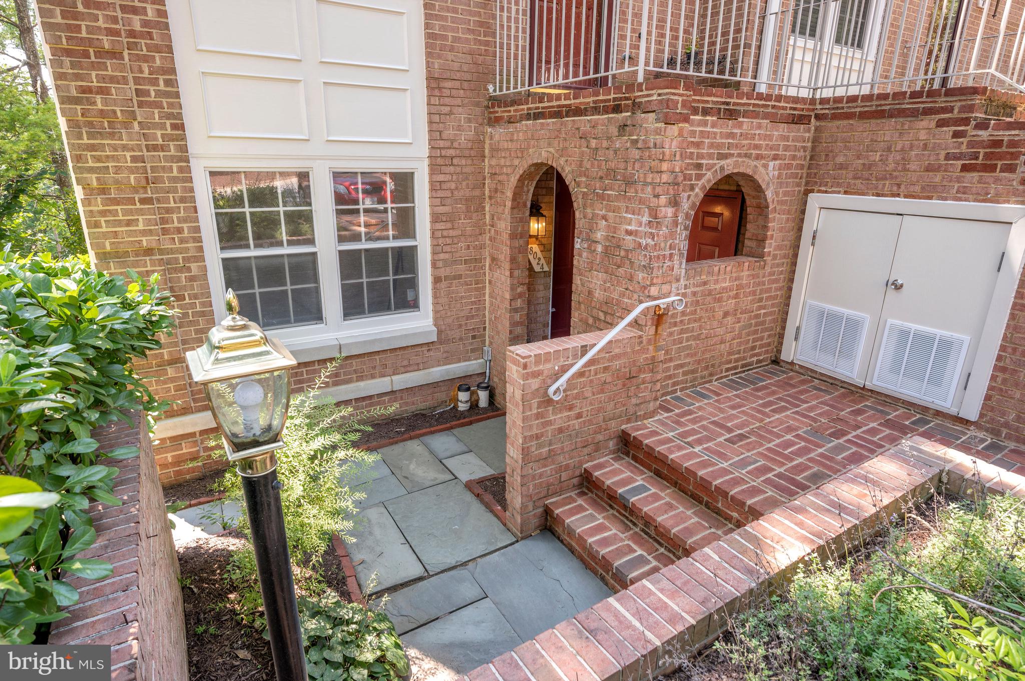 8024 Quarry Ridge Way, Unit 1B Bethesda, MD 20817 - Photo 2 of 16 Quiet flagstone patio for your entry way