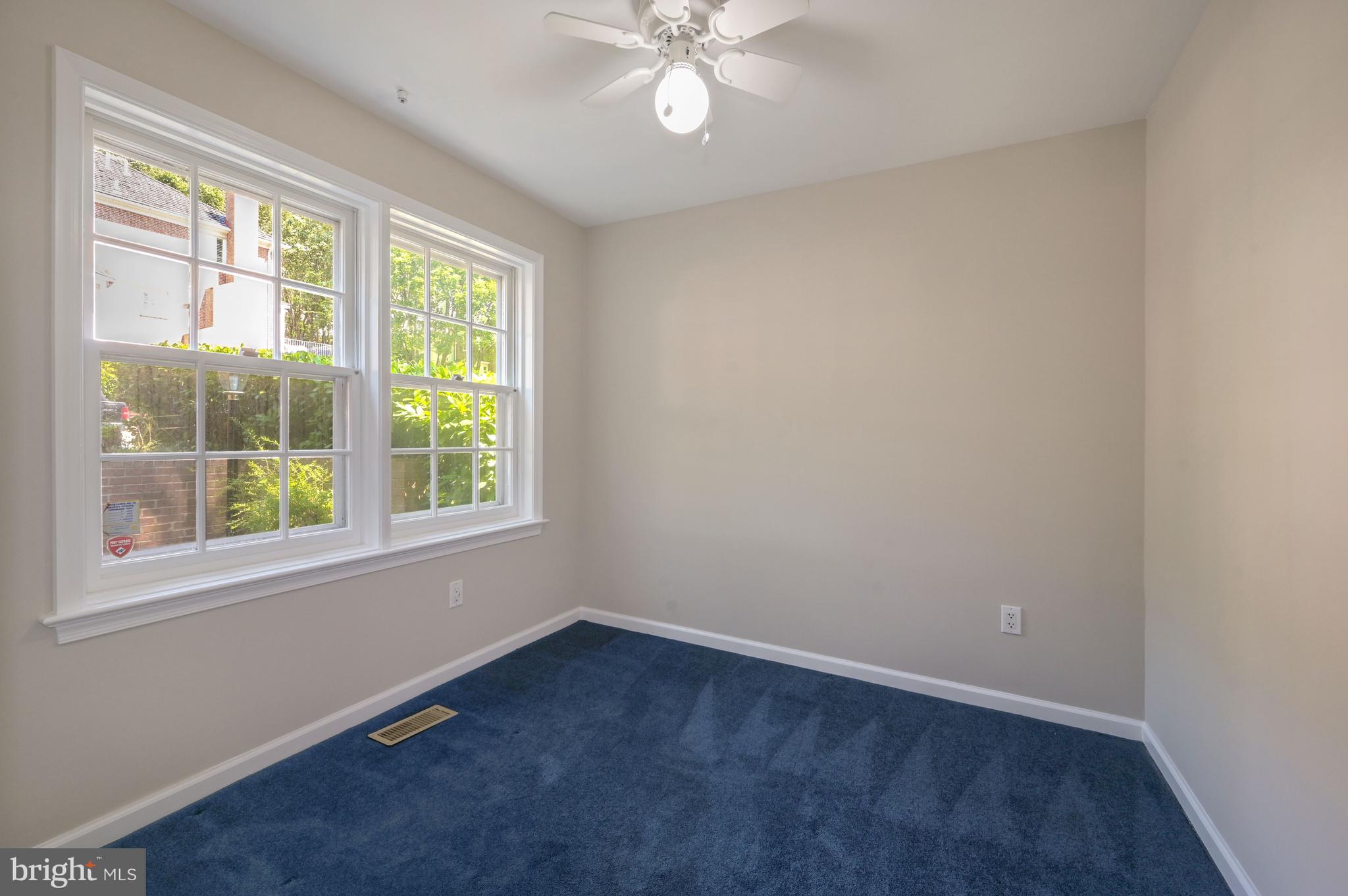 8024 Quarry Ridge Way, Unit 1B Bethesda, MD 20817 - Photo 5 of 16 Bedroom 1 w/ ceiling fan and wall to wall carpet