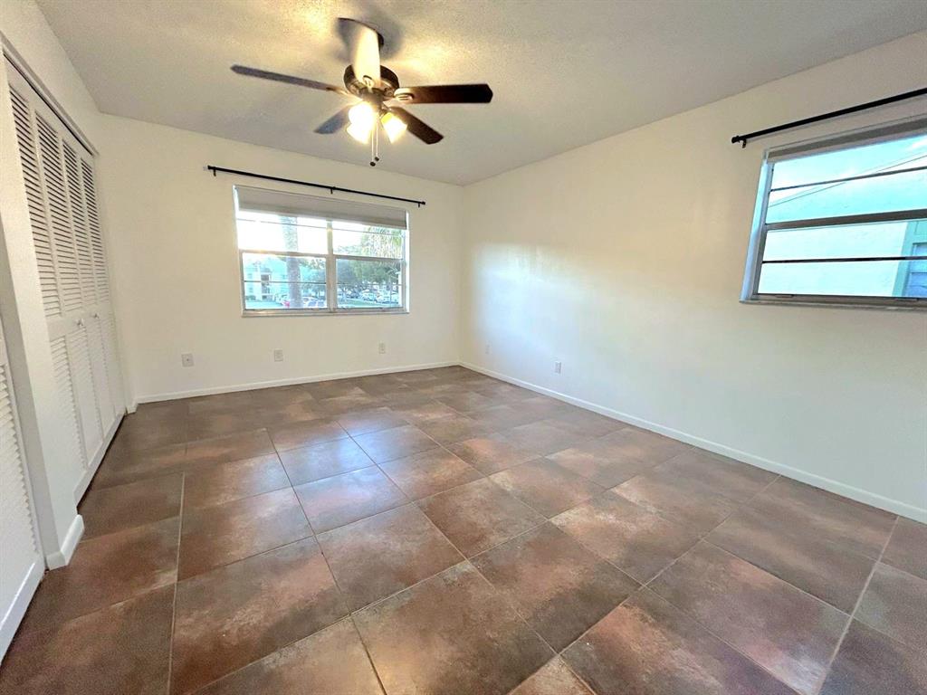 4147 Northwest 90th Avenue, Unit 206 Coral Springs, FL 33065 - Photo 21 of 37 a view of an empty room with a window