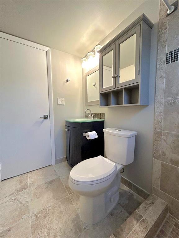 4147 Northwest 90th Avenue, Unit 206 Coral Springs, FL 33065 - Photo 27 of 37 a white toilet sitting next to a bathroom sink