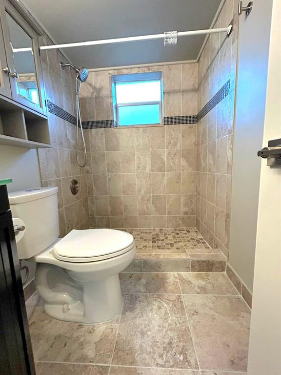 4147 Northwest 90th Avenue, Unit 206 Coral Springs, FL 33065 - Photo 28 of 37 a bathroom with a toilet and a shower