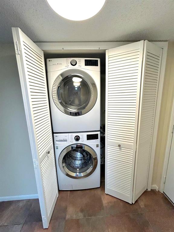 4147 Northwest 90th Avenue, Unit 206 Coral Springs, FL 33065 - Photo 31 of 37 a utility room with dryer and washer