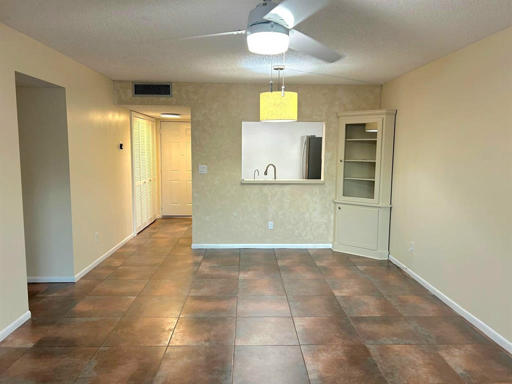 4147 Northwest 90th Avenue, Unit 206 Coral Springs, FL 33065 - Photo 9 of 37 en view of a hallway with wooden floor