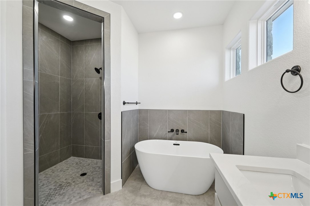 5207 Hollow Ranch Drive Salado, TX 76571 - Photo 23 of 37 a bathroom with a bathtub and shower