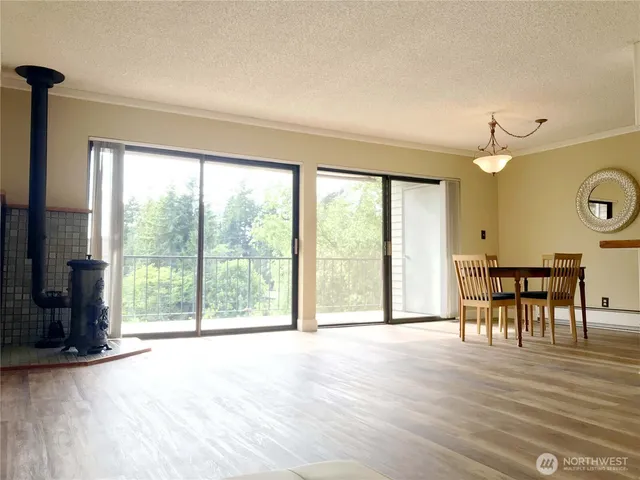 a view of a room with furniture and a large window