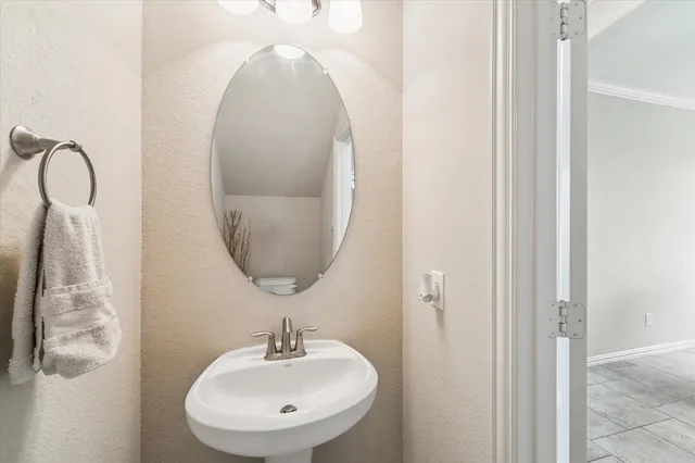 a bathroom with a sink and mirror