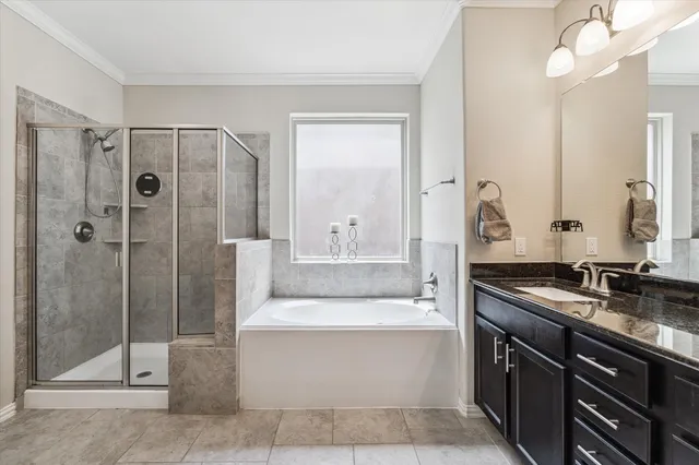 a bathroom with a double vanity sink mirror and shower