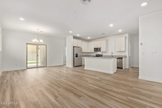 a view of kitchen with wooden floor