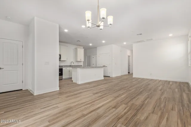 a view of a kitchen with marble kitchen and stainless steel appliances
