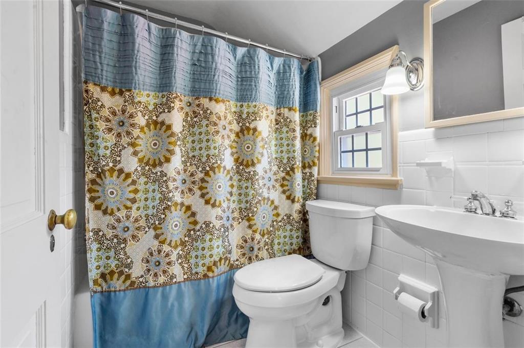 424 Thompson Run Road Pittsburgh, PA 15237 - Photo 18 of 31 a bathroom with a sink toilet and shower