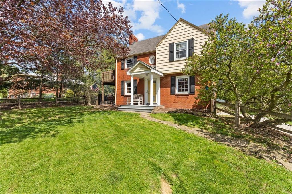 424 Thompson Run Road Pittsburgh, PA 15237 - Photo 2 of 31 a front view of a house with a garden