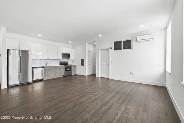 a view of kitchen with wooden floor