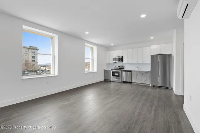 a view of kitchen with wooden floor and window