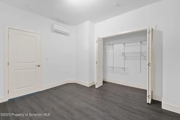 a front view of a building with large windows