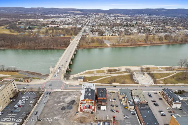 an aerial view of a house with a lake view