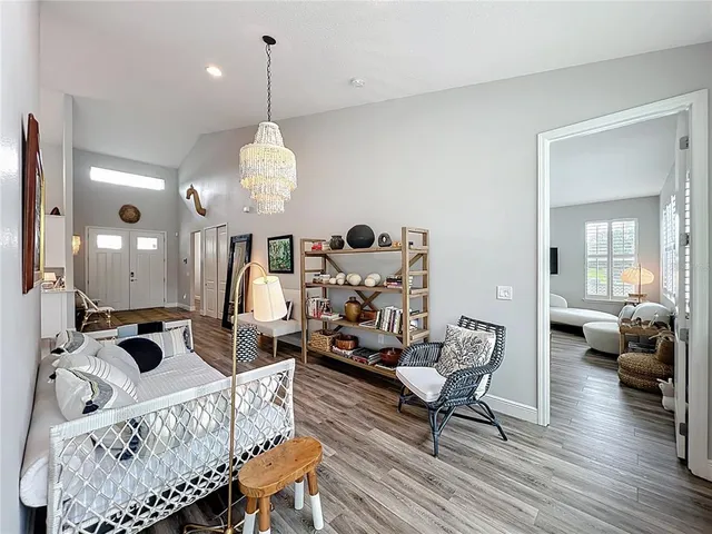 a bed room with a bed and a mirror