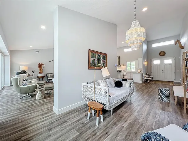 a bedroom with bed couch and window