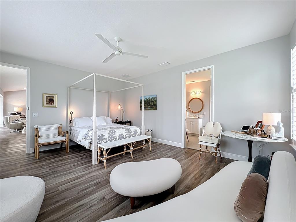 10220 Bay Lake Road Groveland, FL 34736 - Photo 28 of 90 a living room with furniture and wooden floor