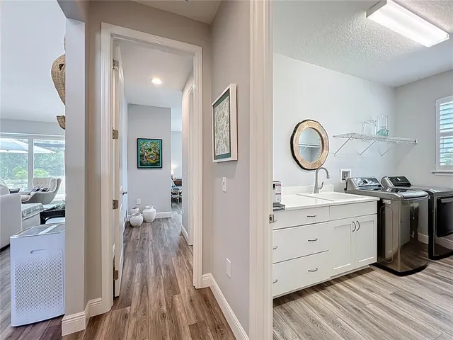 a living room with a floor to ceiling window and floor to ceiling window