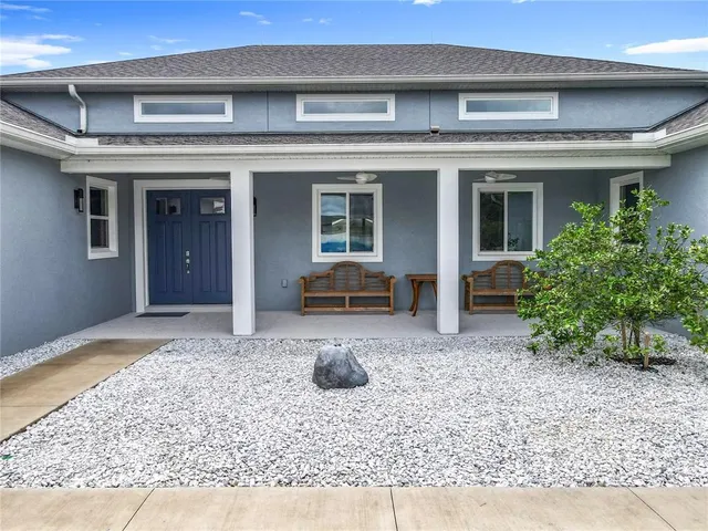 a kitchen with stainless steel appliances a stove a sink and a refrigerator