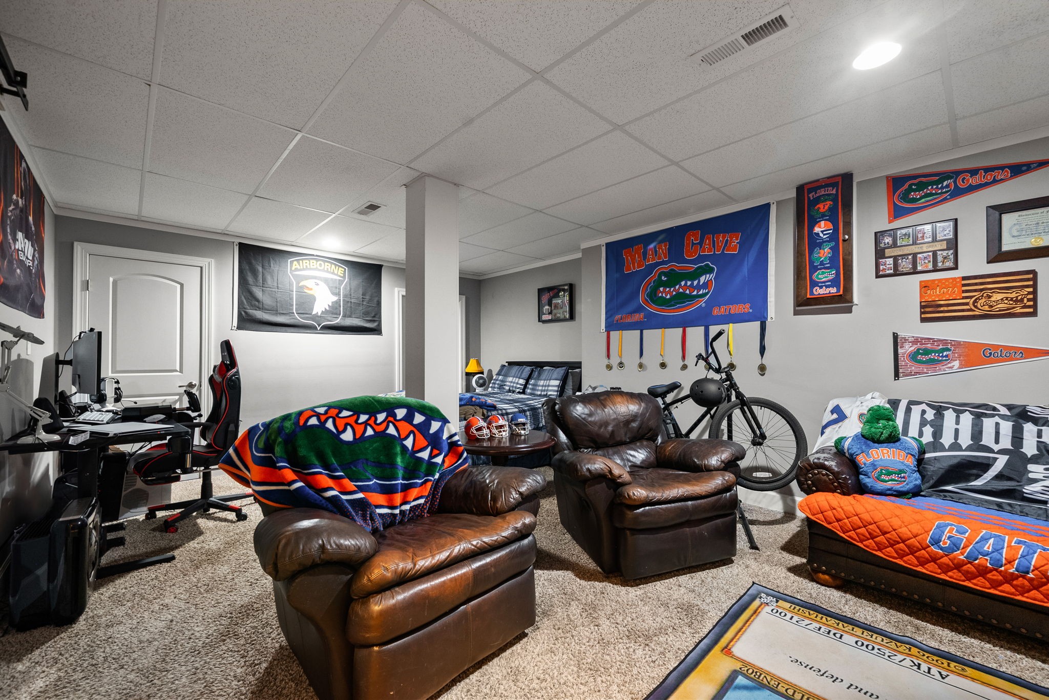1192 Wicke Road Adams, TN 37010 - Photo 42 of 45 a living room with furniture a rug and a flat screen tv