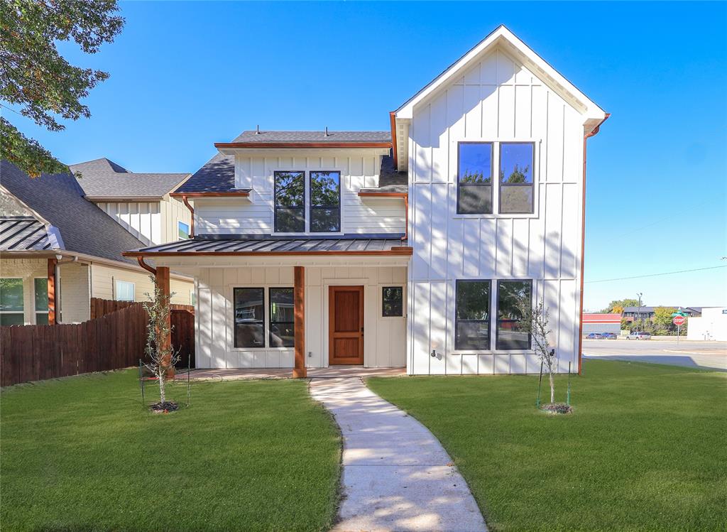 2900 8th Avenue Fort Worth, TX 76110 - Photo 1 of 32 a front view of a house with a yard