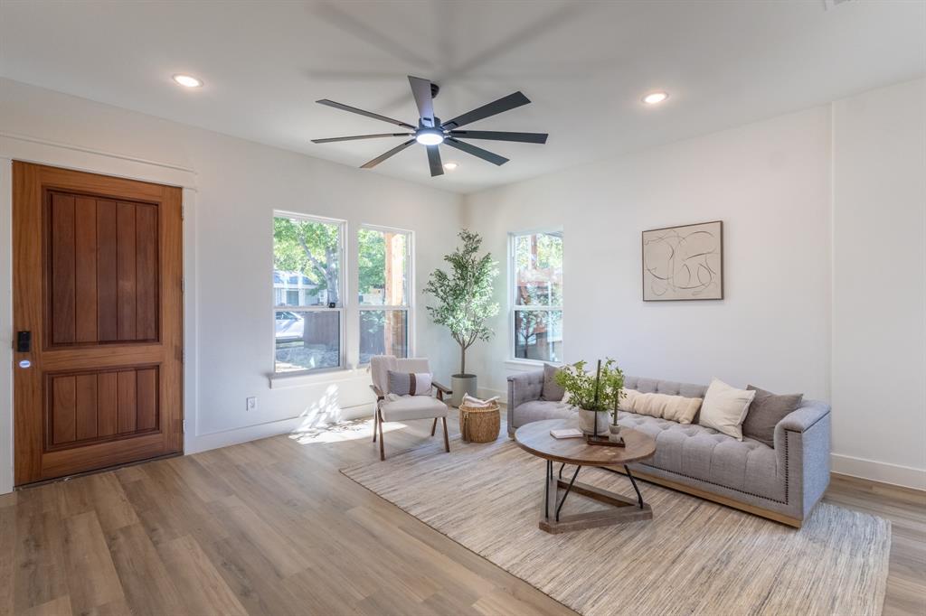 2900 8th Avenue Fort Worth, TX 76110 - Photo 8 of 32 a living room with furniture and a window