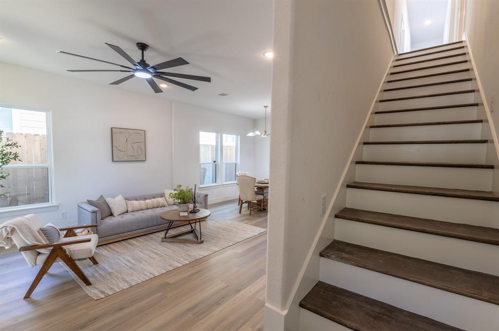 2900 8th Avenue Fort Worth, TX 76110 - Photo 9 of 32 a living room with furniture and a wooden floor