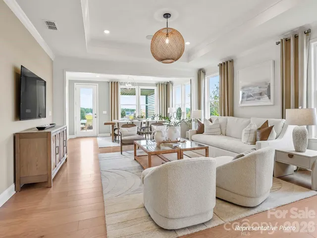 a living room with fireplace furniture and a flat screen tv