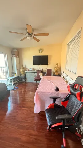 a bedroom with furniture and wooden floor