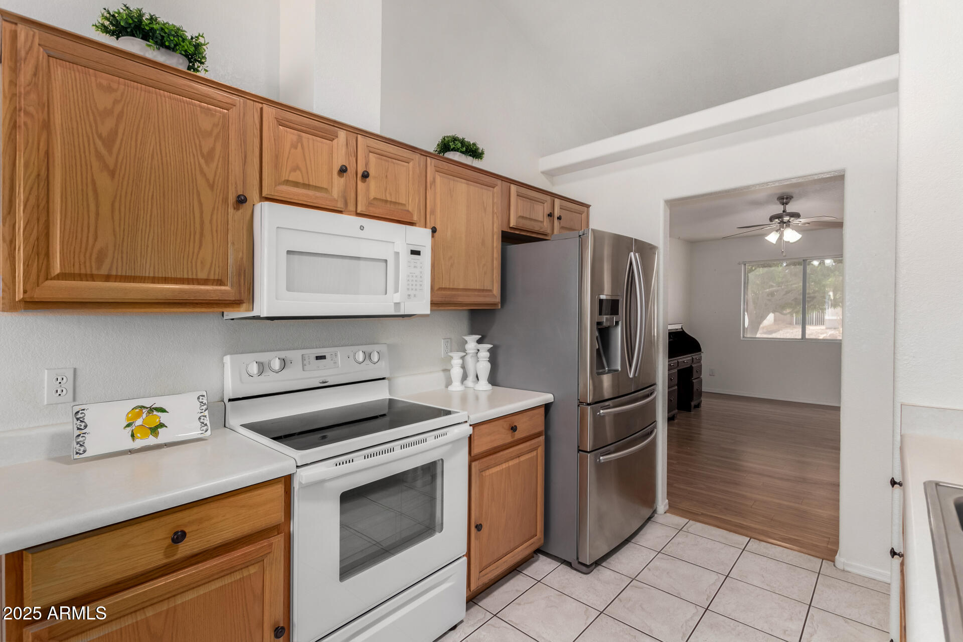 1794 West 11th Avenue Apache Junction, AZ 85120 - Photo 11 of 33 a kitchen with stainless steel appliances granite countertop a refrigerator and a stove
