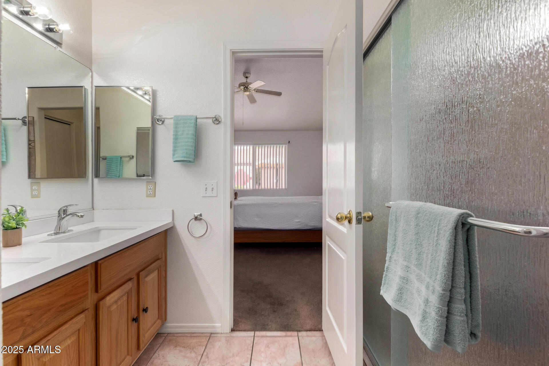 1794 West 11th Avenue Apache Junction, AZ 85120 - Photo 18 of 33 a bathroom with a double vanity sink a mirror and a bathtub