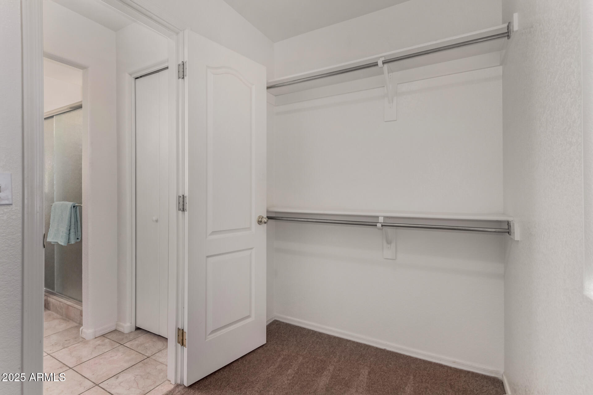 1794 West 11th Avenue Apache Junction, AZ 85120 - Photo 20 of 33 a view of an empty walk in closet