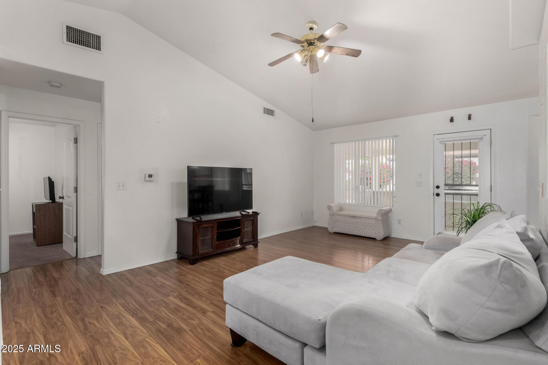1794 West 11th Avenue Apache Junction, AZ 85120 - Photo 2 of 33 a spacious bedroom with a bed and a flat screen tv