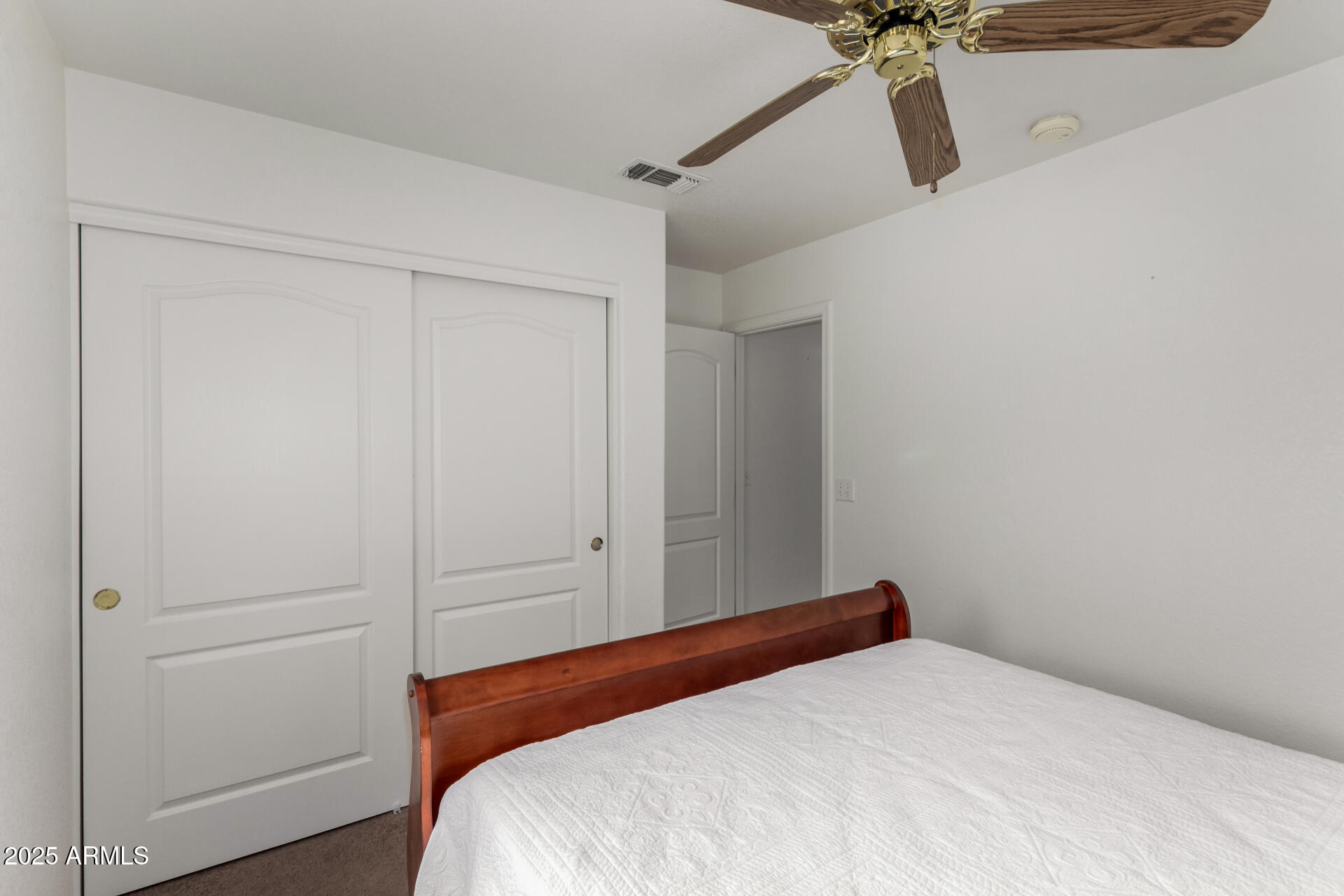1794 West 11th Avenue Apache Junction, AZ 85120 - Photo 22 of 33 a bedroom with a bed and a dresser
