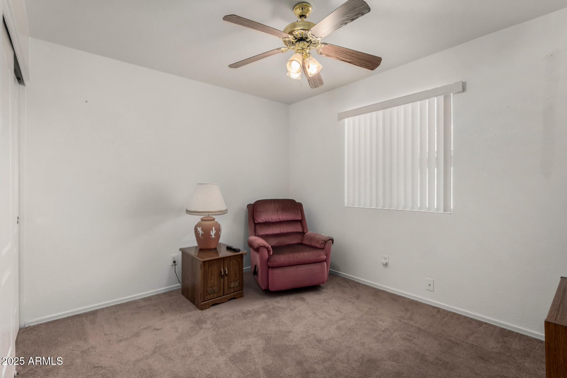 1794 West 11th Avenue Apache Junction, AZ 85120 - Photo 24 of 33 a room with furniture and a ceiling fan