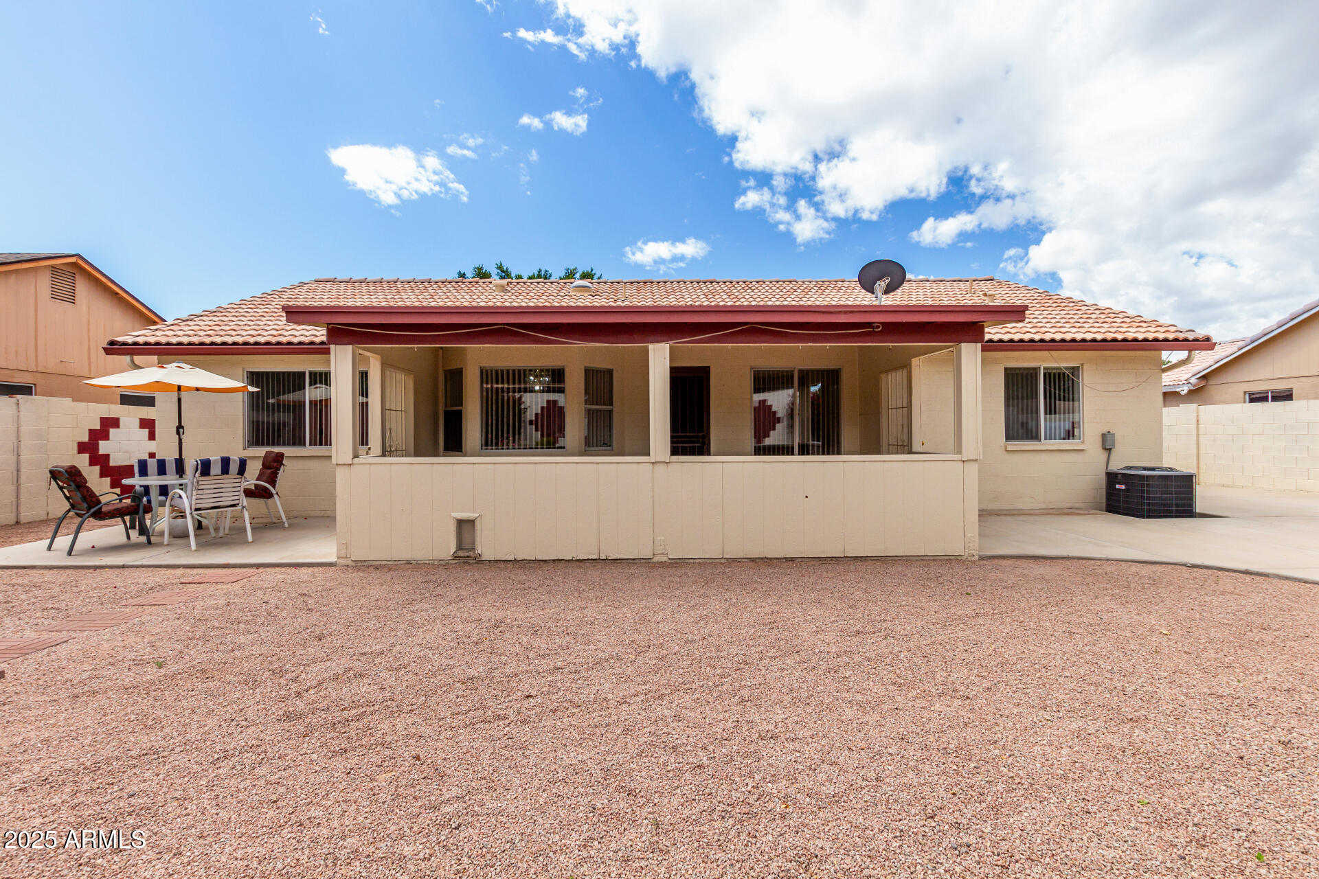1794 West 11th Avenue Apache Junction, AZ 85120 - Photo 30 of 33 a view of a white house with a big yard and potted plants