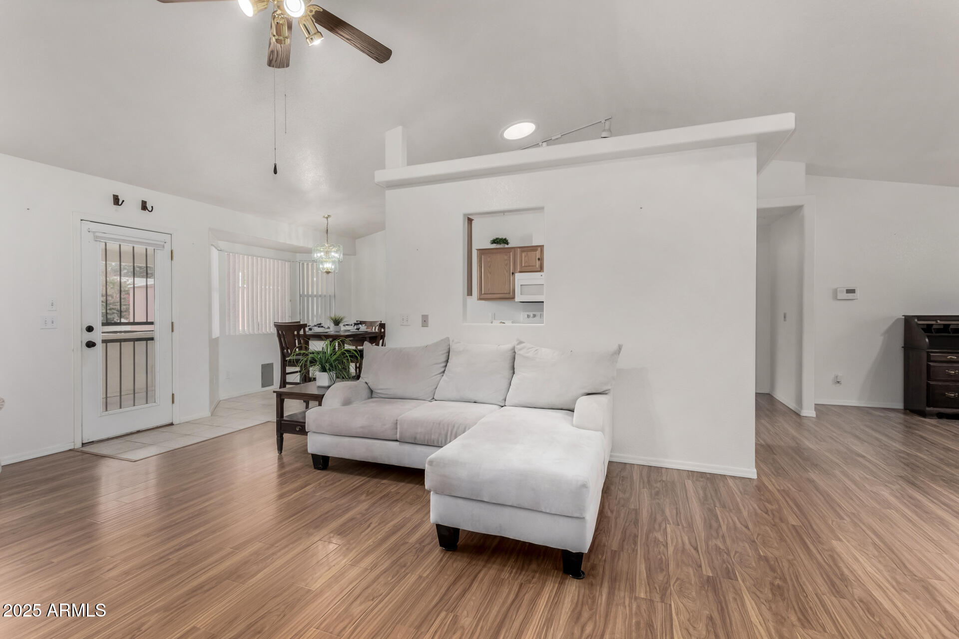 1794 West 11th Avenue Apache Junction, AZ 85120 - Photo 3 of 33 a living room with furniture and a wooden floor