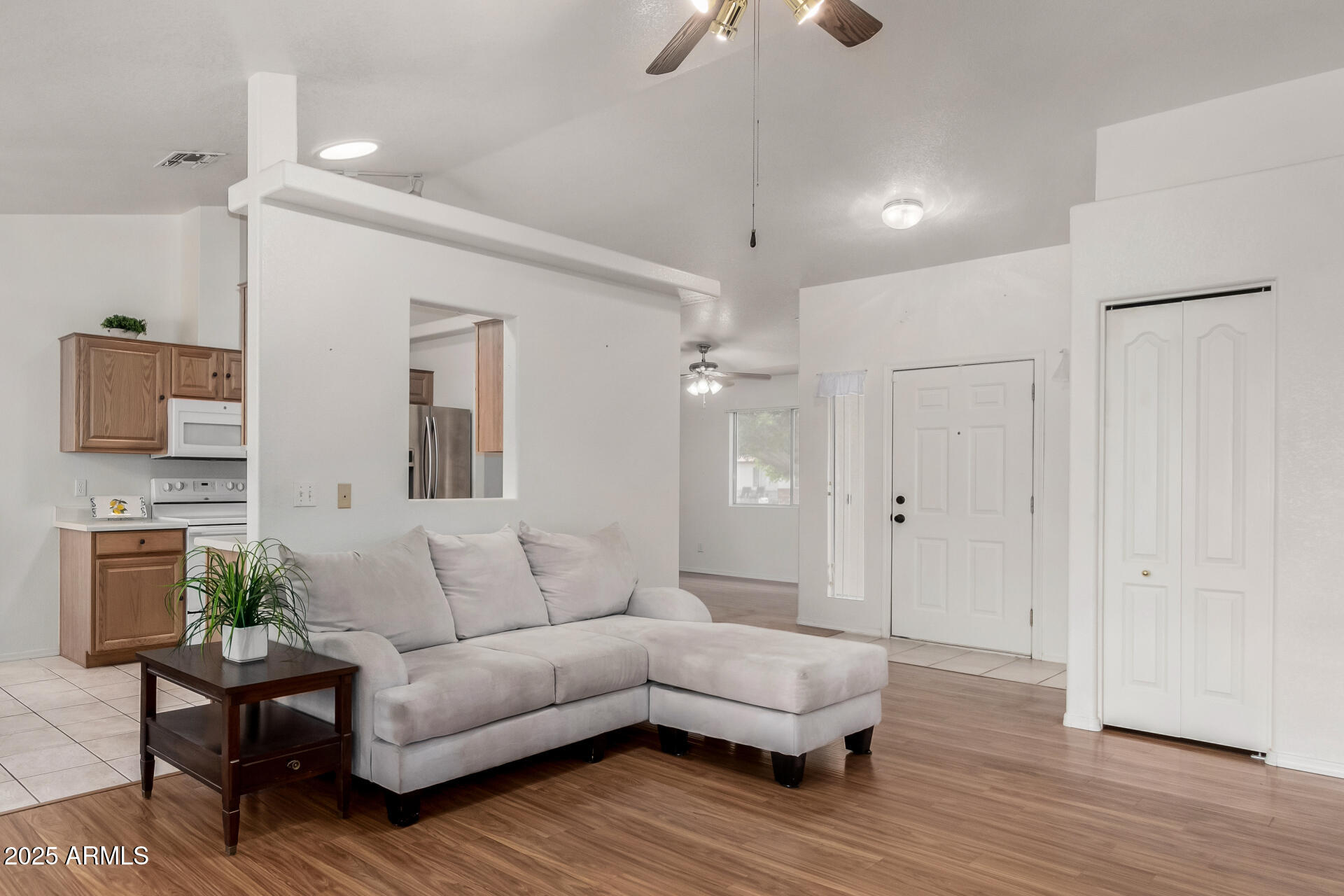 1794 West 11th Avenue Apache Junction, AZ 85120 - Photo 5 of 33 a living room with furniture and a wooden floor