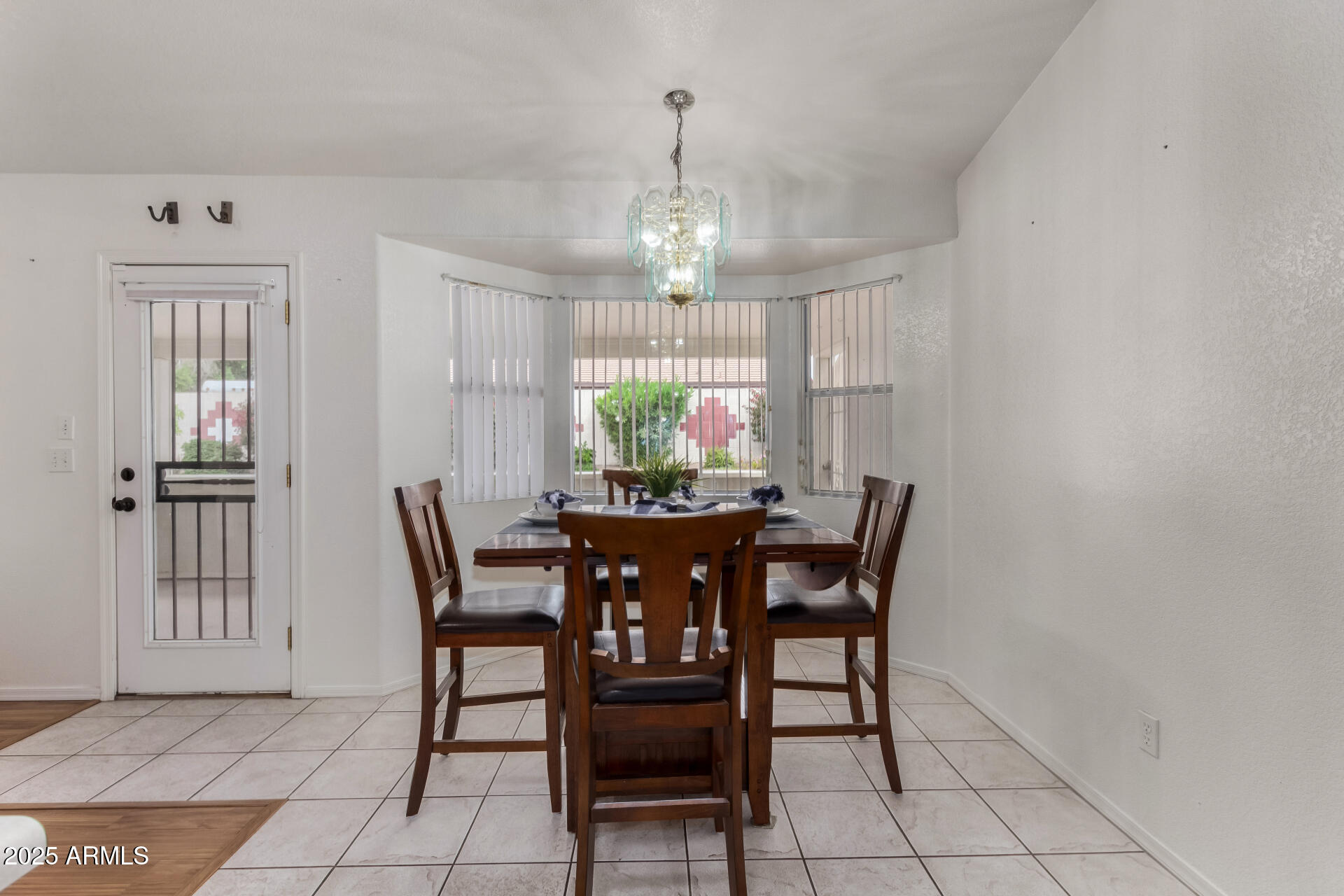 1794 West 11th Avenue Apache Junction, AZ 85120 - Photo 7 of 33 a view of a dining room with furniture and window