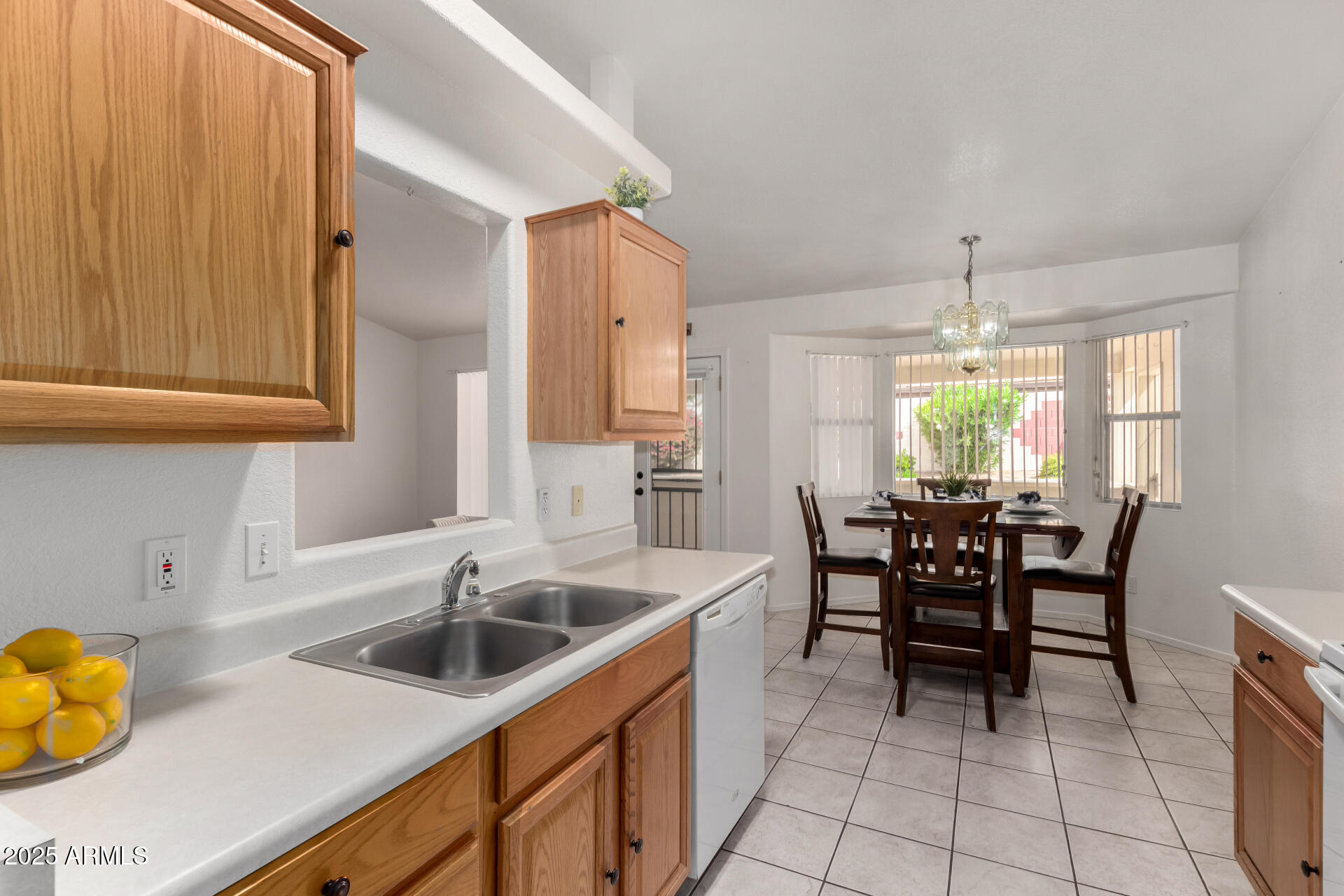 1794 West 11th Avenue Apache Junction, AZ 85120 - Photo 9 of 33 a kitchen with a sink cabinets and window