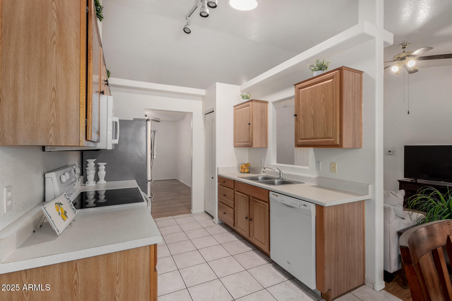 1794 West 11th Avenue Apache Junction, AZ 85120 - Photo 10 of 33 a kitchen with a sink a stove and cabinets