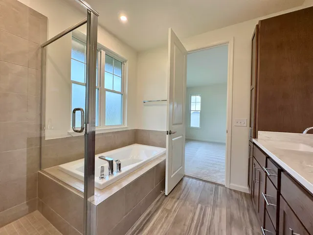 a white toilet sitting next to a shower