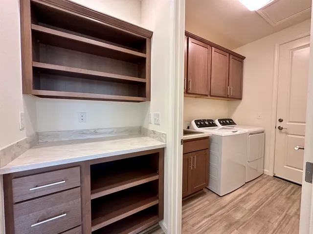 a kitchen with a cabinets and a stove top oven