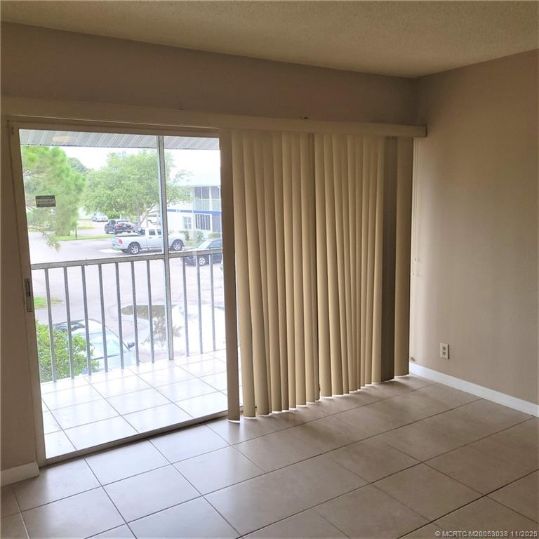 1526 Southeast Royal Green Circle, Unit 205 Port St. Lucie, FL 34952 - Photo 11 of 34 a view of an empty room and window