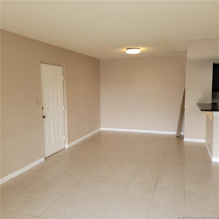 1526 Southeast Royal Green Circle, Unit 205 Port St. Lucie, FL 34952 - Photo 14 of 34 a view of an empty room with a window
