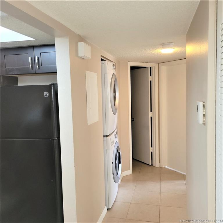 1526 Southeast Royal Green Circle, Unit 205 Port St. Lucie, FL 34952 - Photo 22 of 34 a view of a storage & utility room with refrigerator washer and dryer