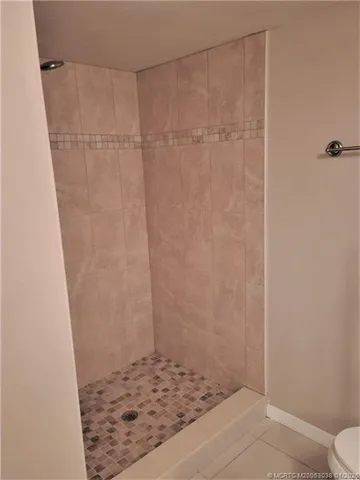 a view of a storage & utility room with refrigerator washer and dryer